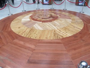 Entry feature of the Village Centre, featuring timber of species in the National Arboretum, arranged in circles representing the mature size of the trunks. The largest is Redwood at 6m.