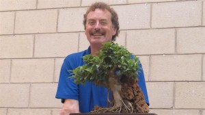 It is better to worry about structure rather than leaf size while growing the branching and when it gets to this stage you have whatever you need and can focus on the leaf size. Defoliation at this stage works very well to reduce leaf size, but they will only stay small if you remove the new shoot while they are small